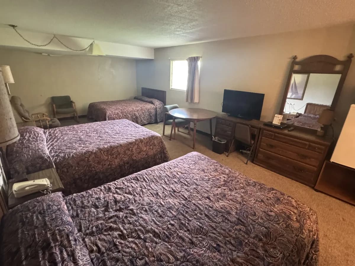 Family Room with 3 queen beds and TV