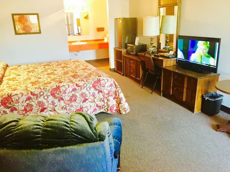 King room with king bed and TV